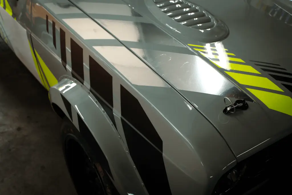 3/4 shot of the front of the Fors Escort MK2. Showing the black, chrome and Flue yellow lines.