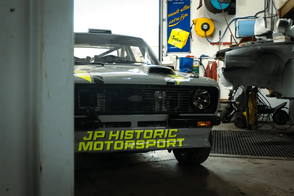 Front view of the Escort MK2, showing the name of JP Historic Motorsport.
